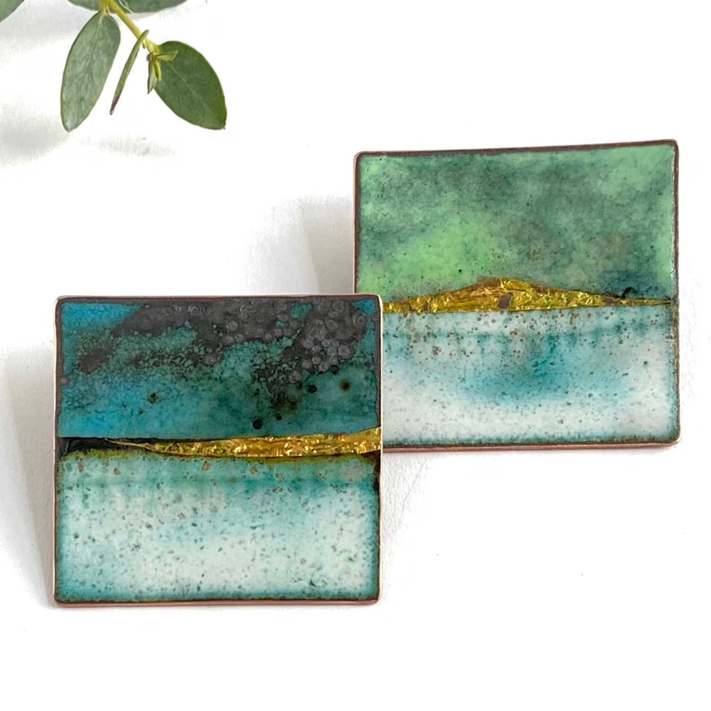 Enamel square stud earrings with landscape design, in shades of blue-green and gold. By Katie Johnston.