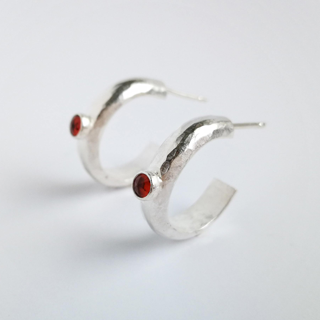 round silver earrings with garnet detail by Victoria Grace Silversmith