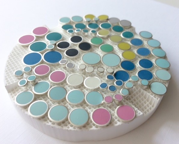 Colour Designs - display of silver circle jewellery with colourful inserts