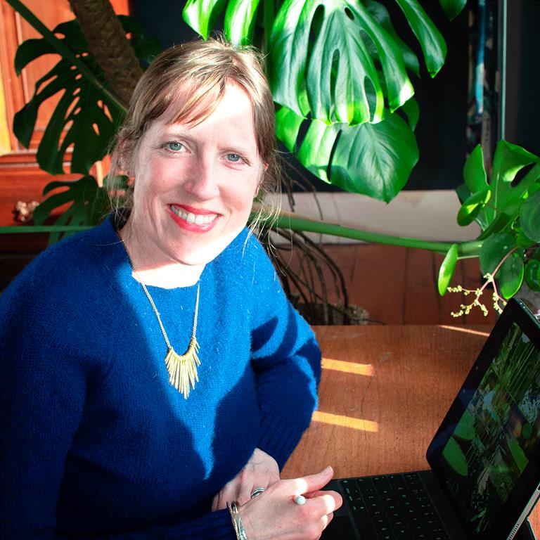 Artist Rosie Reiter working at her computer