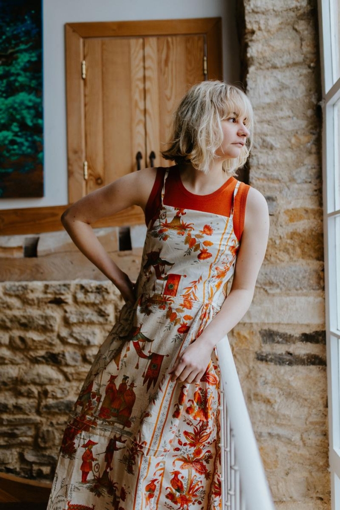 Evie of Daines Atelier wearing 'Gillian Dress' in orange and cream fabric