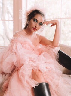 model wearing pale pink tulle dress and head-dress by Bellanude