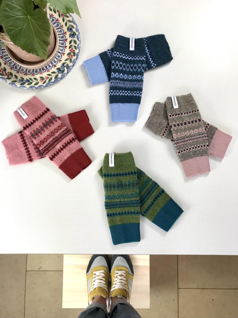 'Hook Norton' patterned woollen handwarmers in various shades.