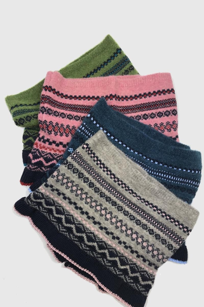 Four patterned woollen snoods in soft colours - grey, blue, pink and moss green, by Cotwold Knits.