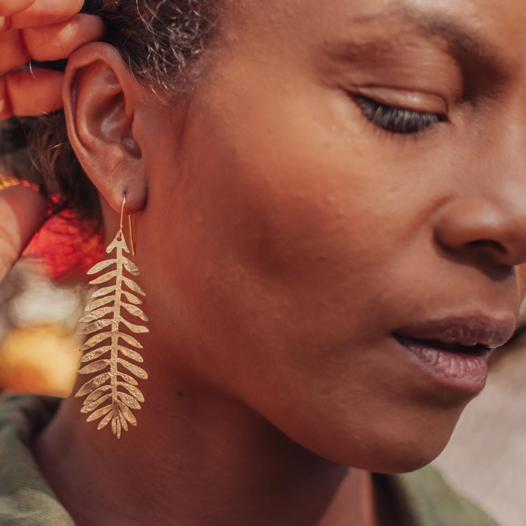 Hand beaten delicate brass earrings by Nic Danning, 'tempest frond'.