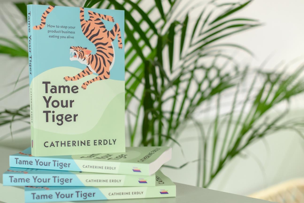 Pile of books - 'Tame Your Tiger - how to stop your product business eating you alive' by Catherine Erdly