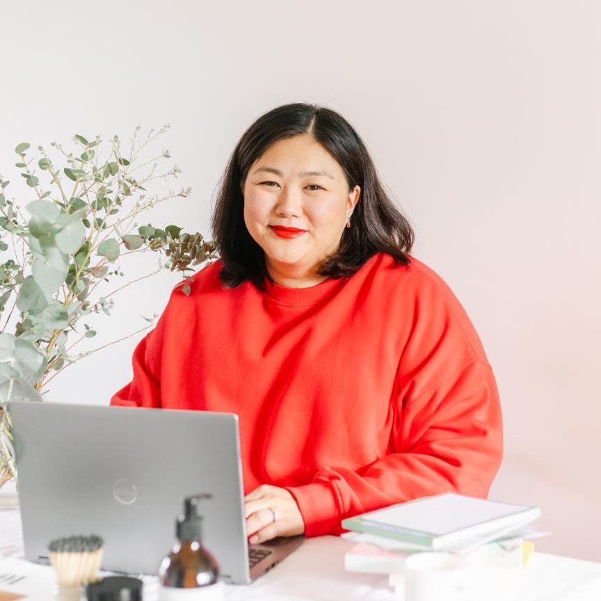 Therese Oertenblad, founder of Small Business Collaborative, sitting at her desk