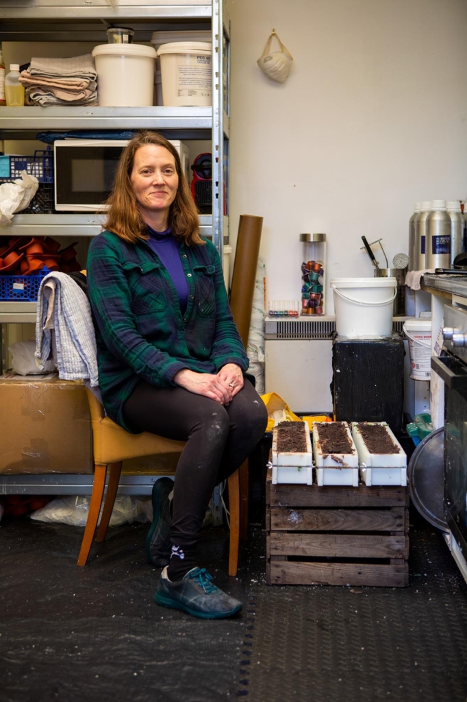 Lisa Woods of Wild Grove soap in her workshop, making troughs of hand-made soap.