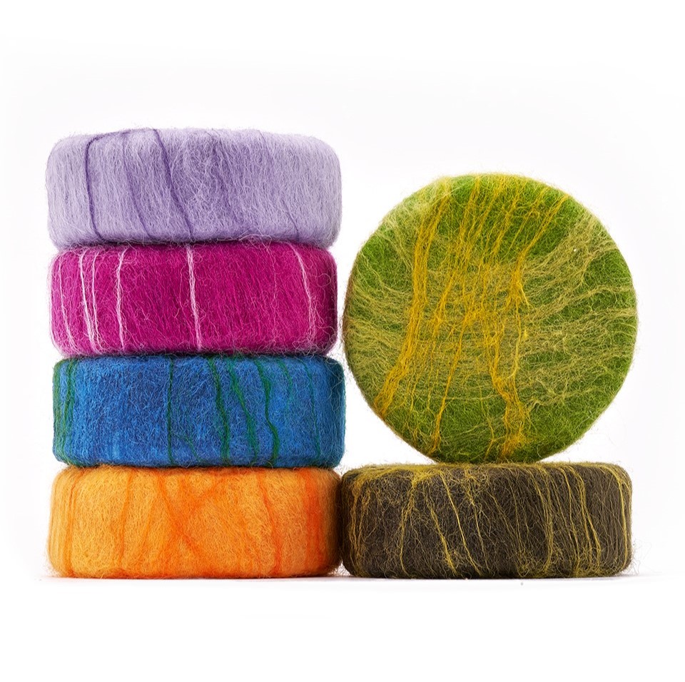 Stack of Wild Grove felted soap, in various bright colours.