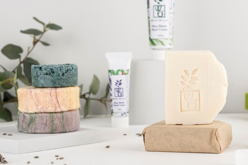 Selection of Wild Grove products - soaps, felted soaps, and hand cream.
