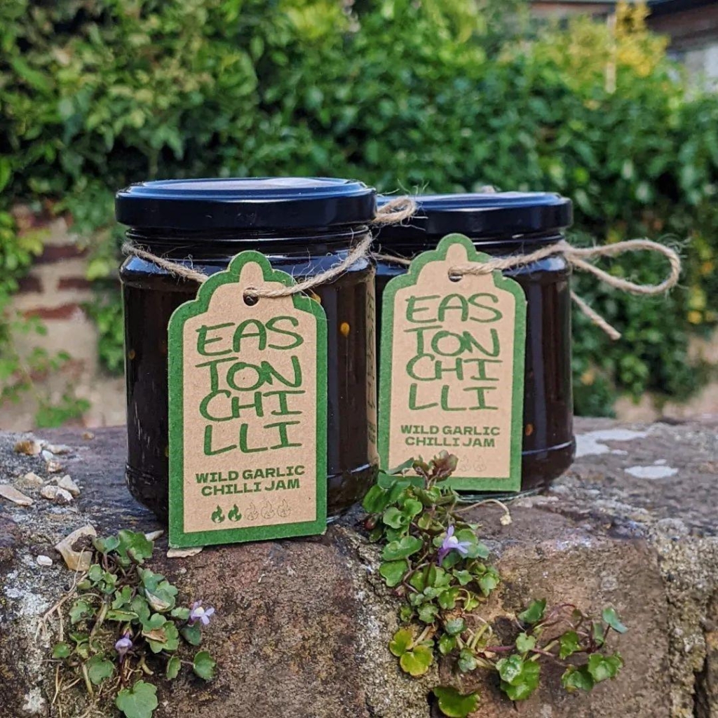 Jars of jam with tag tied on with twine - tags with 'Easton Chilli' logo and 'Wild Garlic Chilli Jam'
